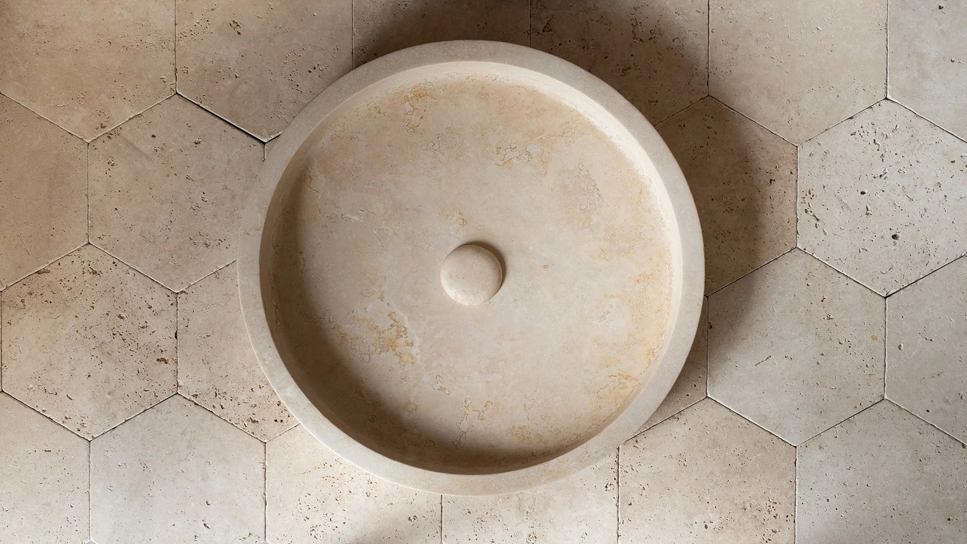 Round travertine washbasin “Round Dish”