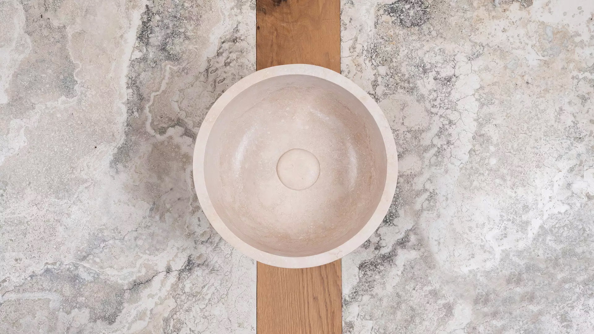 Small round travertine sink “Fianino”