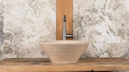 Small, round travertine washbasin “Talla”